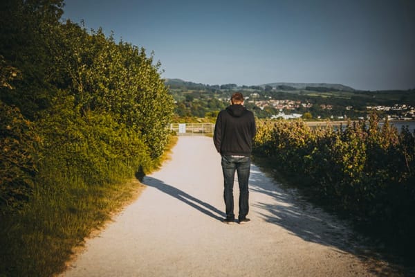 guy alone on dirt road