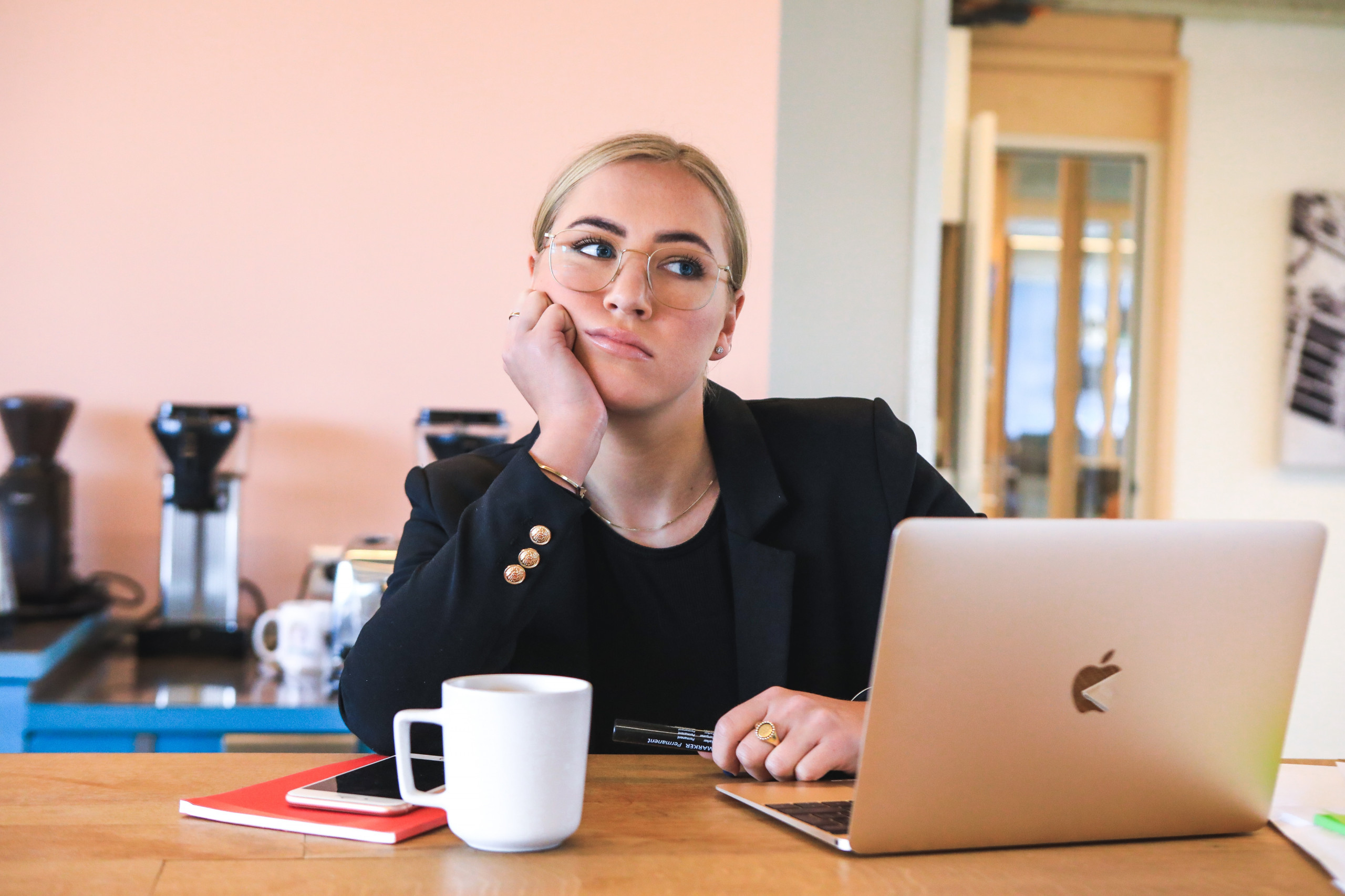 woman in black long sleeve shirt procrastinating